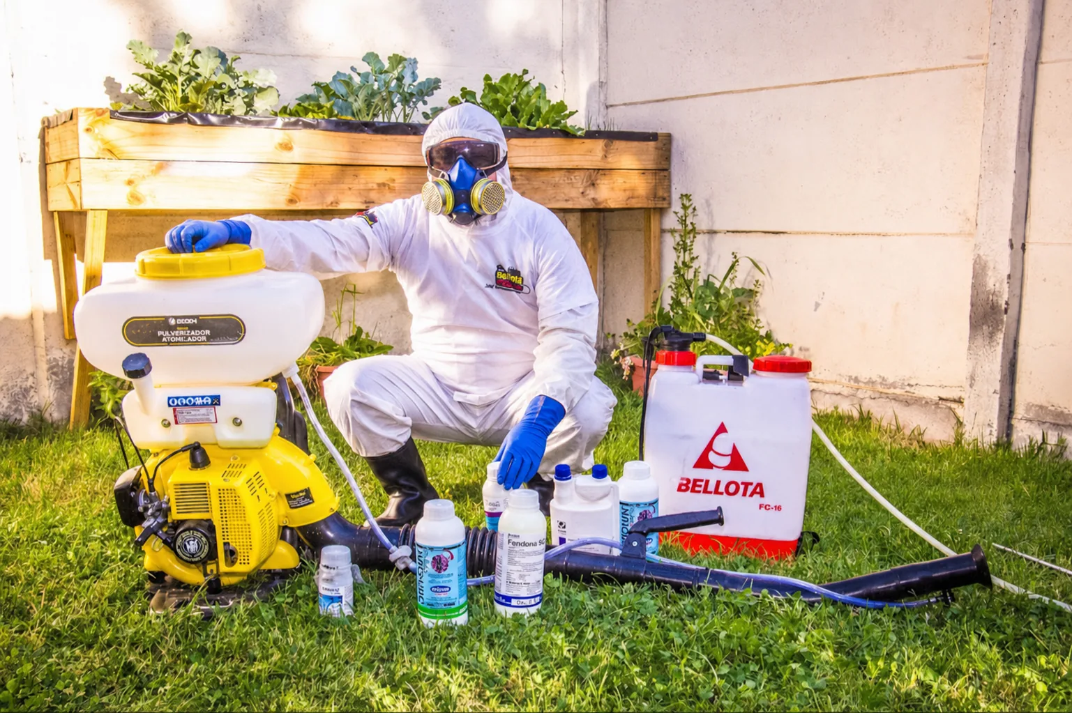 CTRLPLAGAS technician wearing gloves, respirator, goggles, protective coverall and safety boots